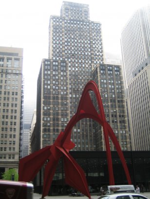 Which is the Setting of this huge red Iron-made Sculpture 